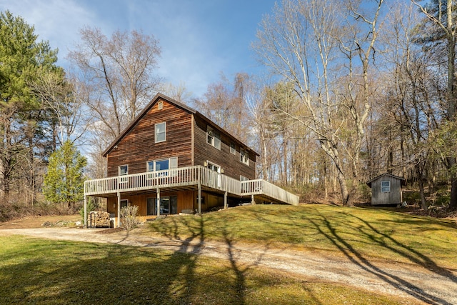 43 Greene Ave, North Canaan, CT 06018 - back of house featuring a shed, a wooden deck, an outdoor structure, and a yard