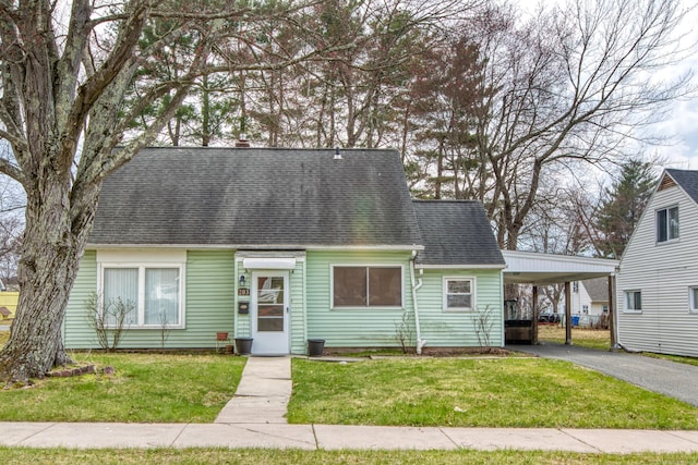 203 Westminster St, Hartford, CT 06112 - cape cod house with a carport, asphalt driveway, a front lawn, and roof with shingles