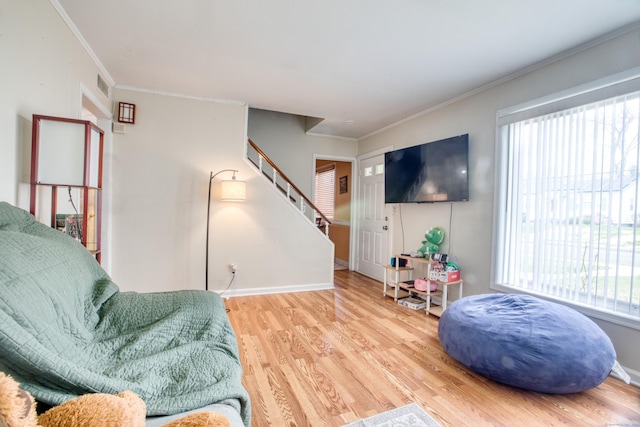 203 Westminster St, Hartford, CT 06112 - sitting room featuring stairway, wood finished floors, plenty of natural light, ornamental molding, and baseboards