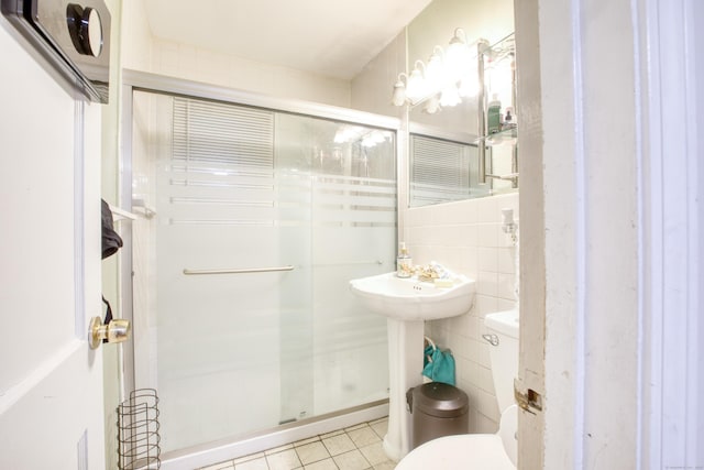 203 Westminster St, Hartford, CT 06112 - full bath featuring toilet, a stall shower, tile walls, and tile patterned floors