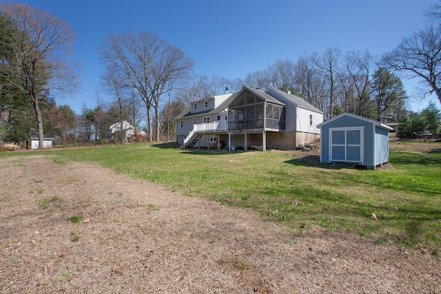 95 Hop Brook Rd, Simsbury, CT 06070 - back of property featuring a sunroom, stairway, and a lawn
