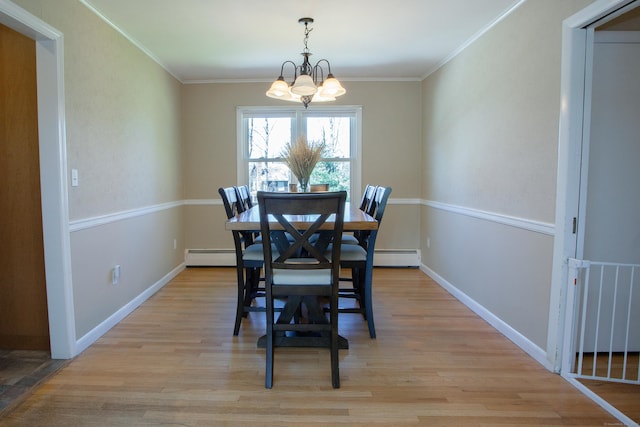 95 Hop Brook Rd, Simsbury, CT 06070 - dining area with a chandelier, a baseboard heating unit, crown molding, light wood finished floors, and baseboards