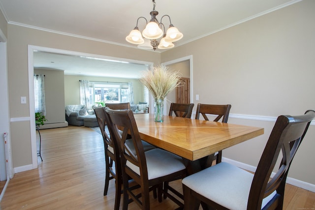95 Hop Brook Rd, Simsbury, CT 06070 - dining room with a chandelier, a baseboard radiator, light wood-style flooring, crown molding, and baseboards
