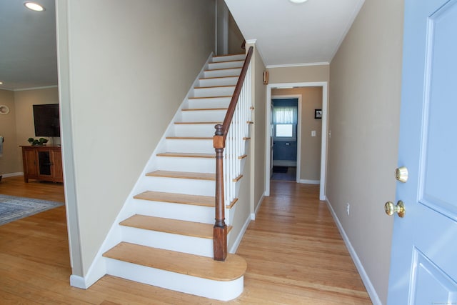 95 Hop Brook Rd, Simsbury, CT 06070 - stairway with ornamental molding, wood finished floors, baseboards, and recessed lighting