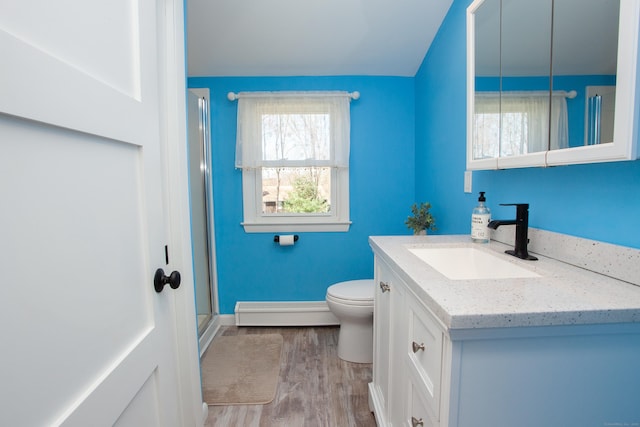 95 Hop Brook Rd, Simsbury, CT 06070 - bathroom featuring a baseboard heating unit, vanity, toilet, wood finished floors, and a stall shower