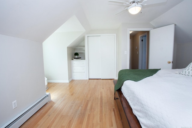 95 Hop Brook Rd, Simsbury, CT 06070 - bedroom with a baseboard heating unit, lofted ceiling, light wood-type flooring, a closet, and ceiling fan