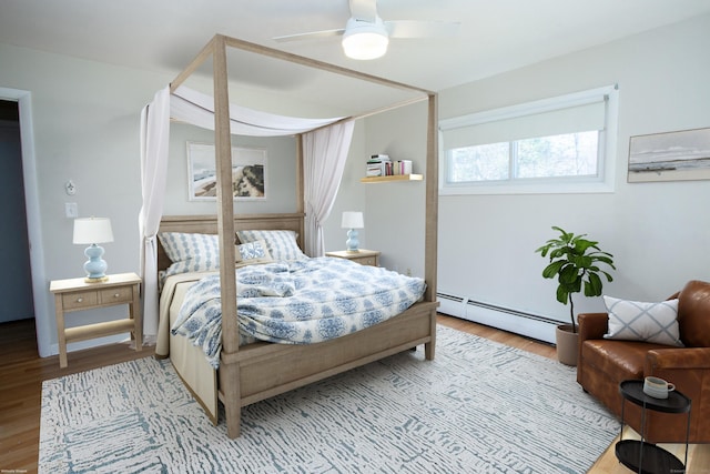 95 Hop Brook Rd, Simsbury, CT 06070 - bedroom featuring a baseboard heating unit, wood finished floors, and a ceiling fan