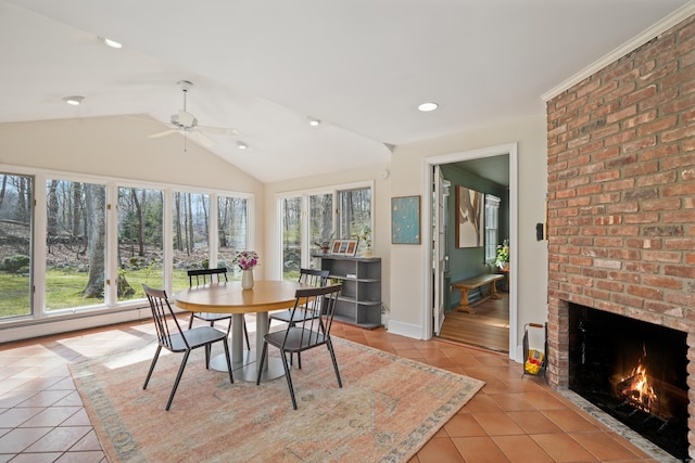 sunroom / solarium featuring recessed lighting, lofted ceiling, tile patterned flooring, a baseboard heating unit, and baseboards