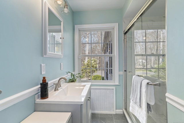 full bathroom featuring vanity and tile patterned flooring