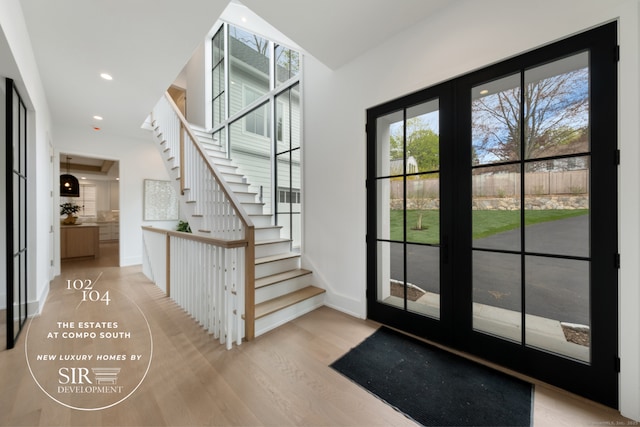 102 Compo Rd S, Westport, CT 06880 - interior space with french doors, recessed lighting, baseboards, wood finished floors, and stairway