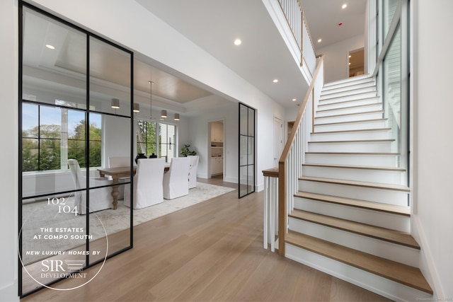 102 Compo Rd S, Westport, CT 06880 - staircase with wood finished floors, baseboards, and recessed lighting