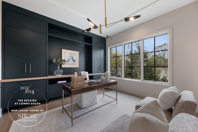 102 Compo Rd S, Westport, CT 06880 - home office with a chandelier and light wood-style floors