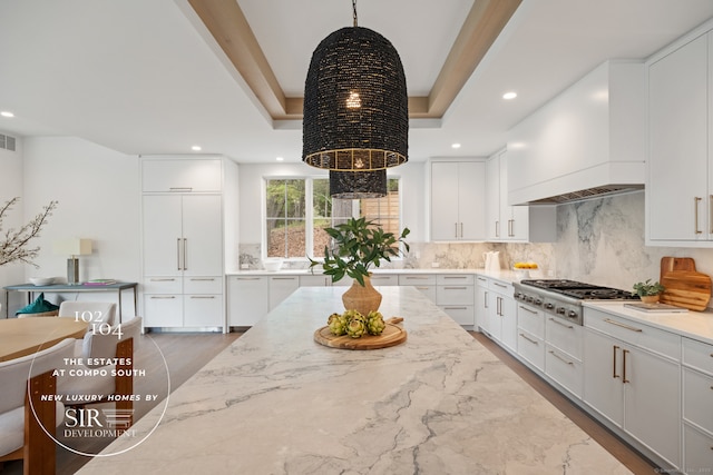 102 Compo Rd S, Westport, CT 06880 - kitchen featuring light stone countertops, recessed lighting, stainless steel gas stovetop, white cabinets, and tasteful backsplash