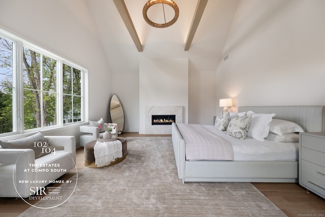 102 Compo Rd S, Westport, CT 06880 - bedroom with a premium fireplace, wood finished floors, beamed ceiling, and high vaulted ceiling