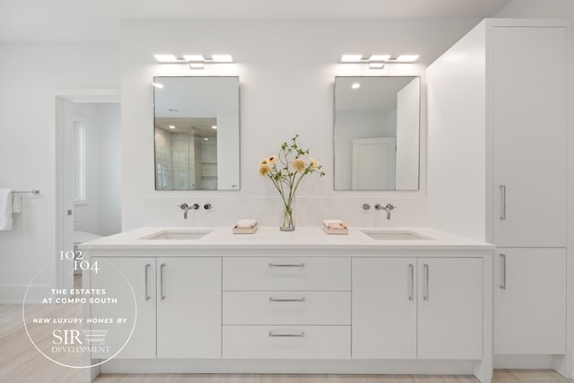 102 Compo Rd S, Westport, CT 06880 - bathroom with walk in shower, double vanity, toilet, and a sink