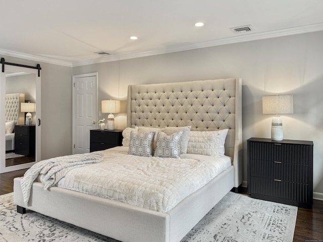 18 Cardinal Rd, Weston, CT 06883 - bedroom featuring a barn door, wood finished floors, crown molding, and recessed lighting