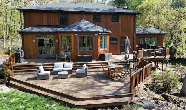 18 Cardinal Rd, Weston, CT 06883 - rear view of house with a wooden deck, roof with shingles, and french doors
