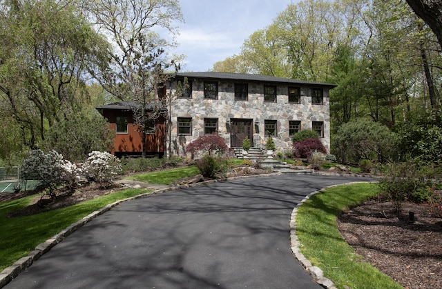 18 Cardinal Rd, Weston, CT 06883 - view of front facade featuring stone siding and driveway