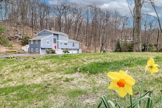 594 Barrack Hill Rd, Ridgefield, CT 06877 - view of front facade featuring a chimney, an attached garage, and a view of trees