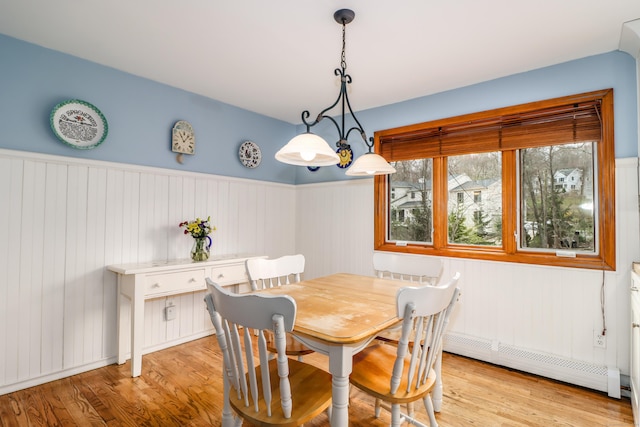 594 Barrack Hill Rd, Ridgefield, CT 06877 - dining space featuring a baseboard heating unit, light wood-style floors, and wainscoting