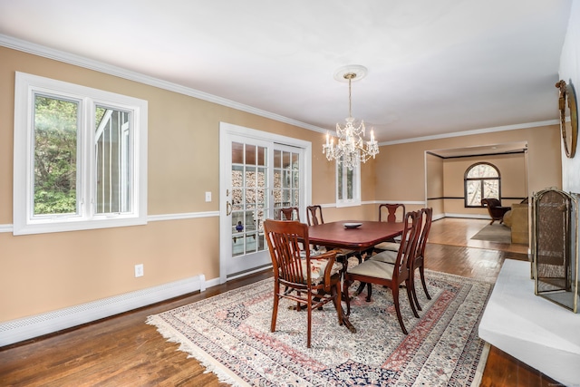 594 Barrack Hill Rd, Ridgefield, CT 06877 - dining area featuring a baseboard heating unit, a chandelier, ornamental molding, wood finished floors, and baseboards