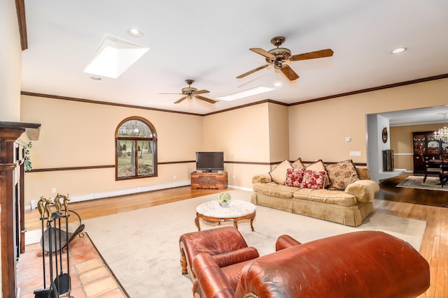 594 Barrack Hill Rd, Ridgefield, CT 06877 - living room with wood finished floors, a skylight, recessed lighting, a ceiling fan, and ornamental molding
