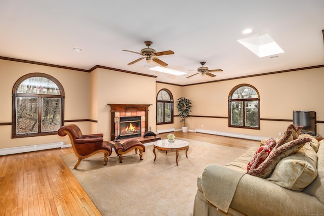 594 Barrack Hill Rd, Ridgefield, CT 06877 - living room with hardwood / wood-style floors, a skylight, a baseboard radiator, healthy amount of natural light, and recessed lighting