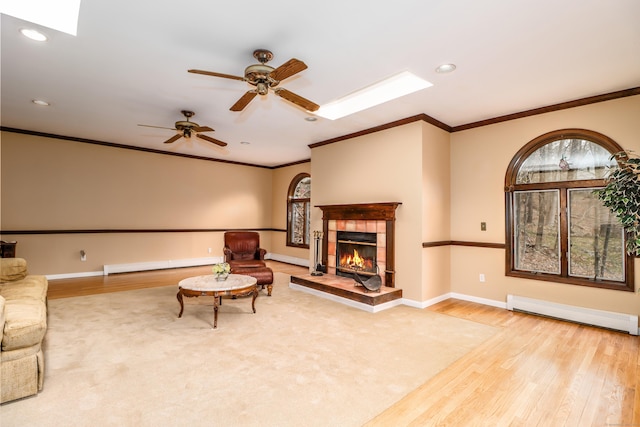 594 Barrack Hill Rd, Ridgefield, CT 06877 - unfurnished living room with a skylight, wood finished floors, baseboard heating, crown molding, and recessed lighting