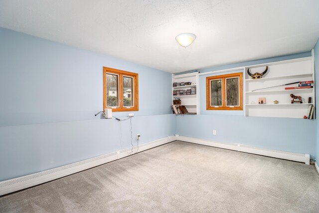 594 Barrack Hill Rd, Ridgefield, CT 06877 - carpeted empty room featuring a baseboard radiator and built in shelves