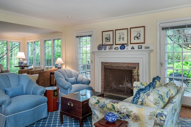 341 Housatonic River Rd, Salisbury, CT 06068 - living area featuring ornamental molding, healthy amount of natural light, a brick fireplace, and wood finished floors