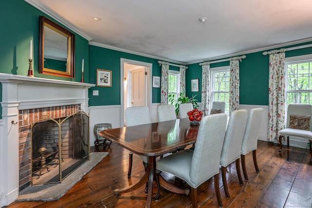 341 Housatonic River Rd, Salisbury, CT 06068 - dining room featuring wainscoting, a fireplace, hardwood / wood-style floors, crown molding, and healthy amount of natural light