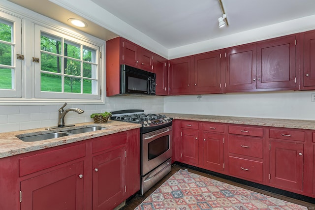 341 Housatonic River Rd, Salisbury, CT 06068 - kitchen with black microwave, stainless steel gas range, a sink, decorative backsplash, and reddish brown cabinets