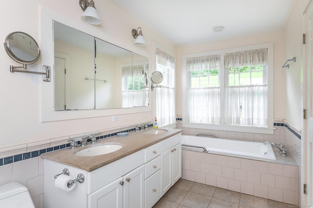 341 Housatonic River Rd, Salisbury, CT 06068 - bathroom featuring a garden tub, toilet, double vanity, tile patterned floors, and crown molding