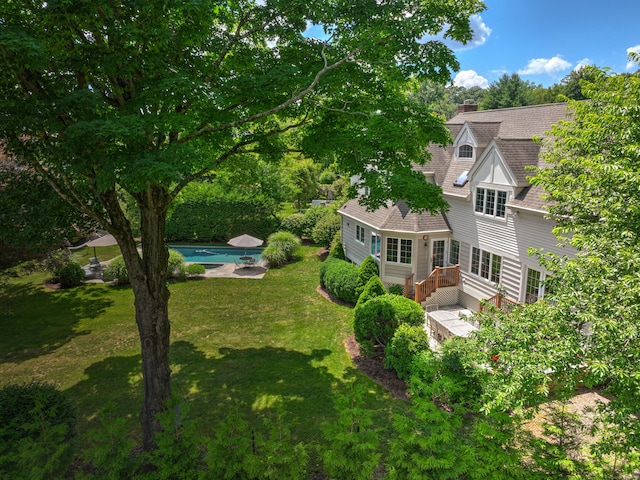 exterior space featuring an outdoor pool