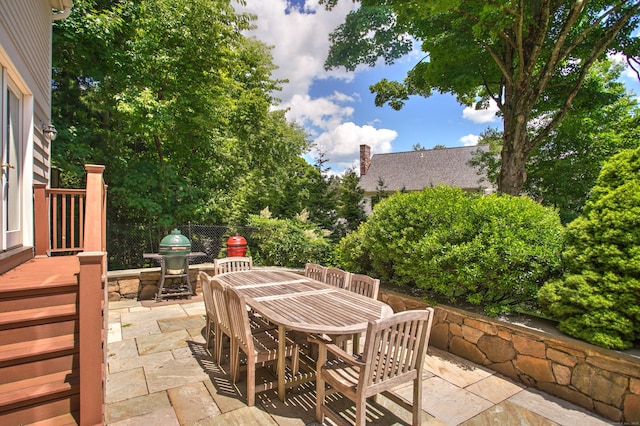view of patio / terrace featuring outdoor dining area and a grill