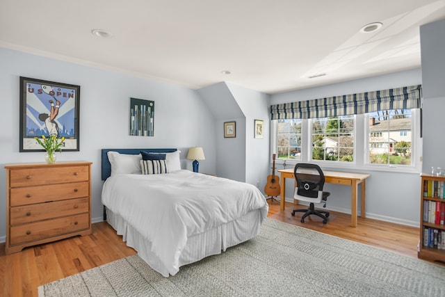 bedroom with recessed lighting, baseboards, and wood finished floors