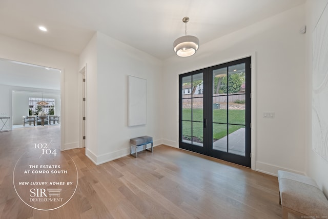104 Compo Rd S, Westport, CT 06880 - doorway featuring baseboards, light wood-style floors, french doors, and recessed lighting