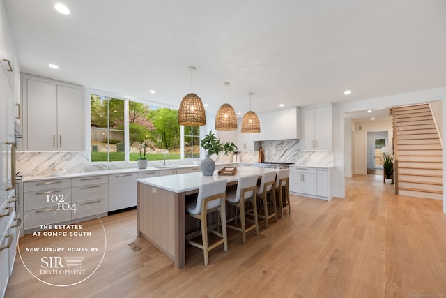 104 Compo Rd S, Westport, CT 06880 - kitchen with light countertops, a center island, recessed lighting, and decorative backsplash
