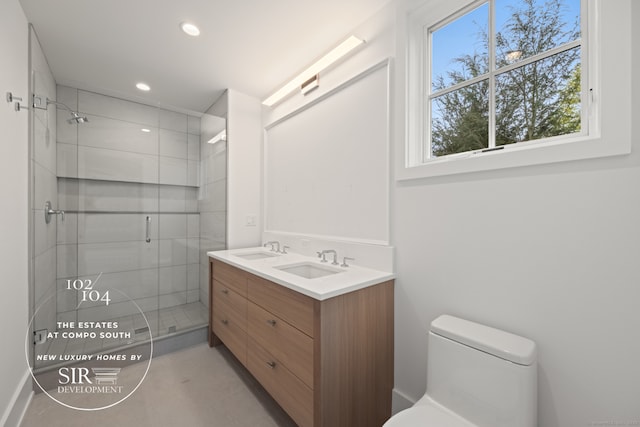 104 Compo Rd S, Westport, CT 06880 - bathroom with a sink, toilet, a stall shower, and recessed lighting
