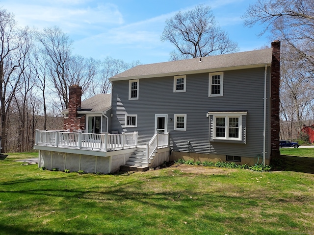 43 Attawanhood Trl, Hebron, CT 06231 - rear view of property featuring a wooden deck, a lawn, and a chimney