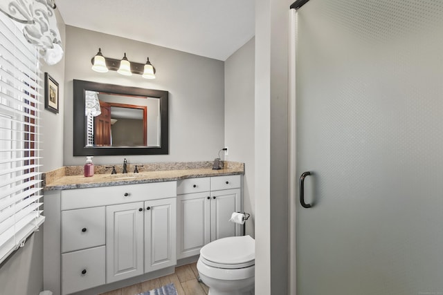 43 Attawanhood Trl, Hebron, CT 06231 - full bath featuring wood finished floors, vanity, toilet, and an enclosed shower