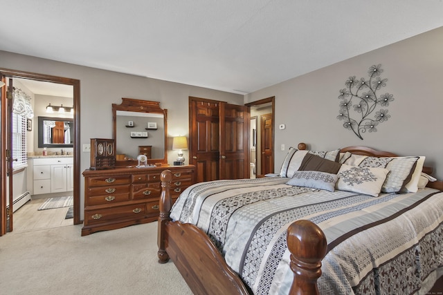 43 Attawanhood Trl, Hebron, CT 06231 - bedroom with a baseboard heating unit, light carpet, ensuite bathroom, and a closet