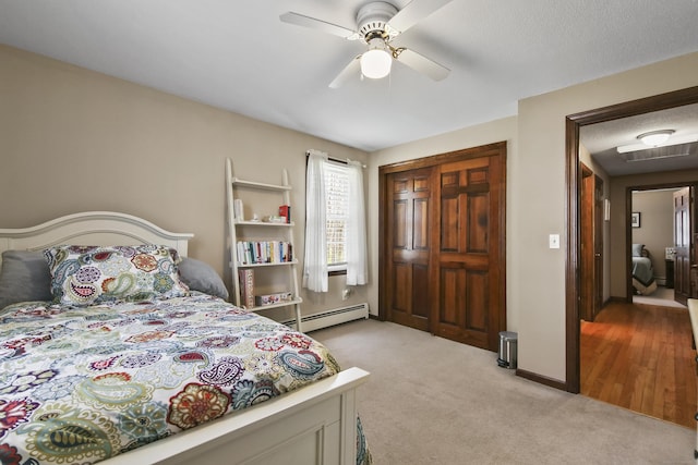 43 Attawanhood Trl, Hebron, CT 06231 - bedroom with a baseboard heating unit, visible vents, ceiling fan, and light carpet