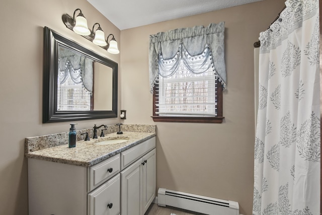 43 Attawanhood Trl, Hebron, CT 06231 - full bath with a baseboard radiator, vanity, plenty of natural light, and a shower with curtain