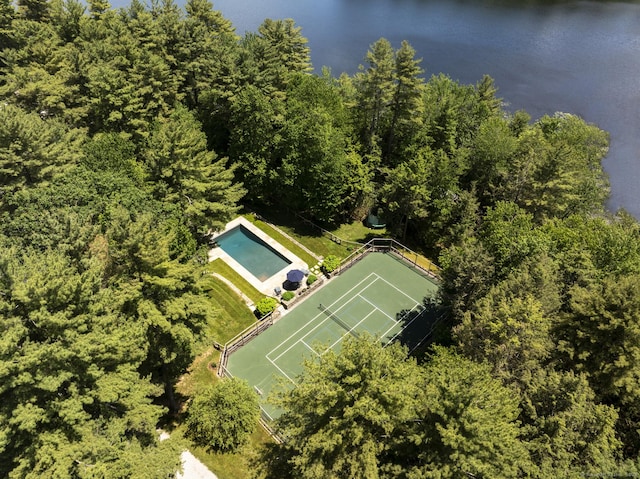 drone / aerial view featuring a forest view
