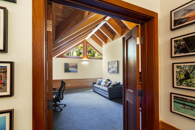 home office featuring carpet floors and lofted ceiling