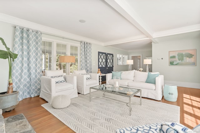 47 Peaceable St, Ridgefield, CT 06877 - living area featuring wood finished floors, ornamental molding, beam ceiling, and baseboards