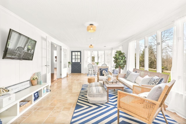 47 Peaceable St, Ridgefield, CT 06877 - living area with crown molding, french doors, and light stone finish floors