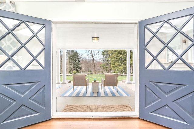 47 Peaceable St, Ridgefield, CT 06877 - foyer entrance featuring ornate columns, plenty of natural light, and wood finished floors