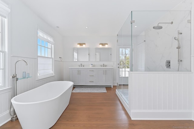 47 Peaceable St, Ridgefield, CT 06877 - bathroom with a freestanding tub, a marble finish shower, healthy amount of natural light, and wainscoting